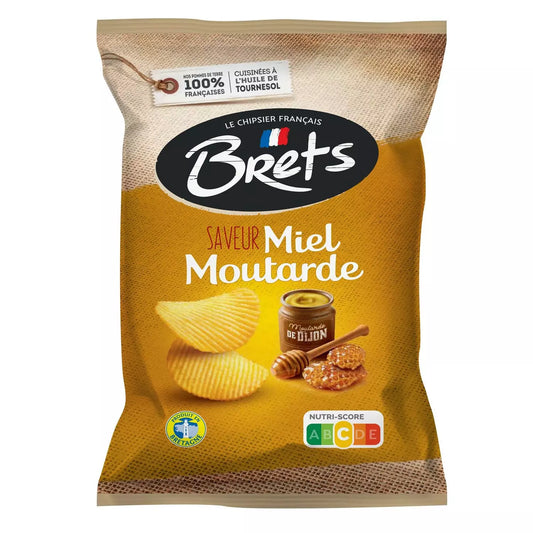 A package of BRETS Wavy Chips with Honey Mustard flavor. The packaging is predominantly yellow and brown, with images of the chips and mustard.